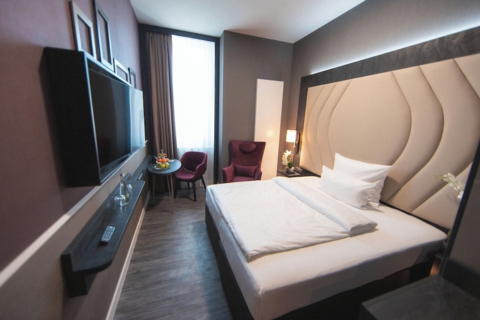 Imagen de la habitación del Hotel PLAZA Premium Heidelberg. Foto 8