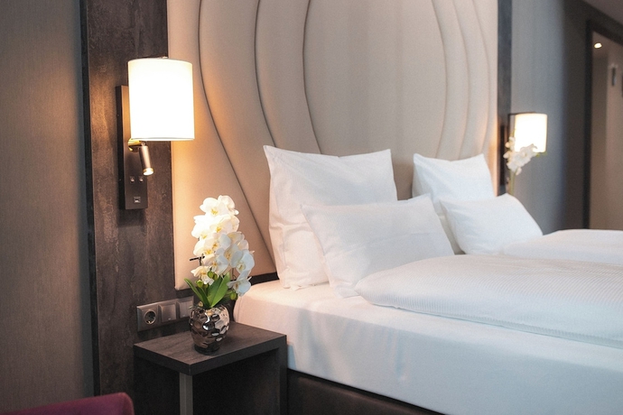 Imagen de la habitación del Hotel PLAZA Premium Heidelberg. Foto 13