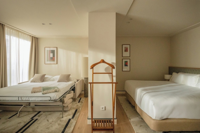Imagen de la habitación del Hotel POSTCODE Atocha. Foto 7