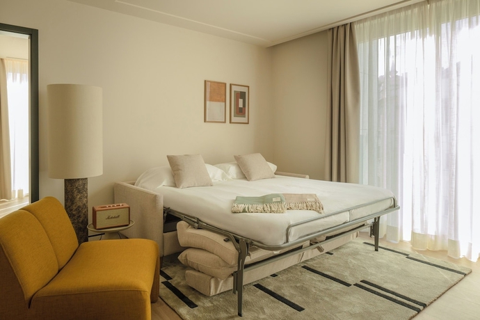 Imagen de la habitación del Hotel POSTCODE Atocha. Foto 11