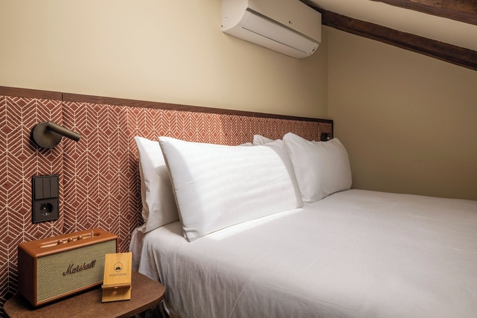 Imagen de la habitación del Hotel POSTCODE Chueca. Foto 11