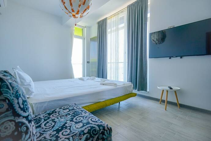 Imagen de la habitación del Hotel PROMENADA Alezzi Apartments. Foto 14