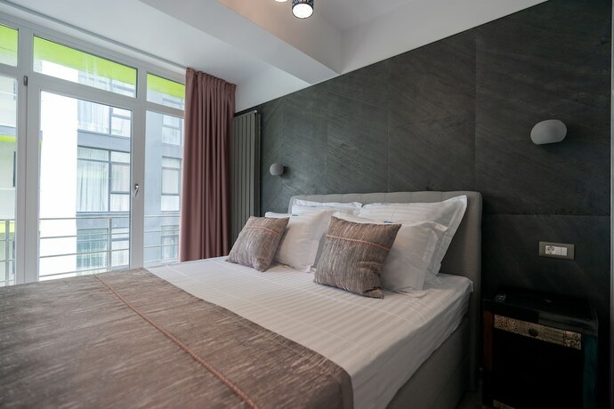 Imagen de la habitación del Hotel PROMENADA Alezzi Apartments. Foto 19