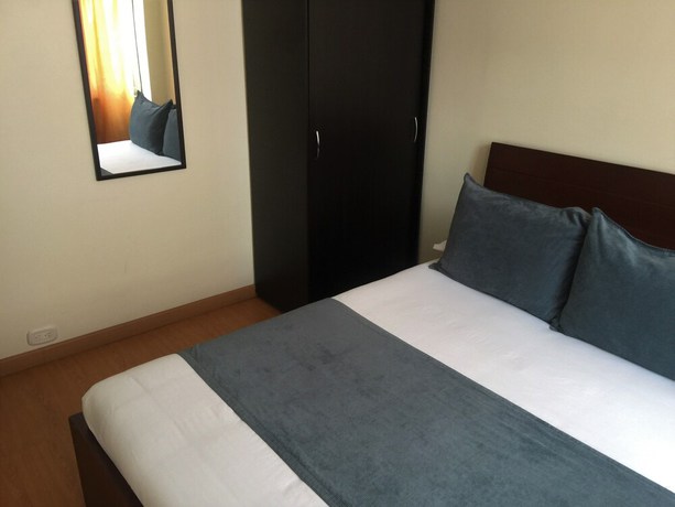 Imagen de la habitación del Hotel PSH Pasajero Suites Corferias. Foto 2