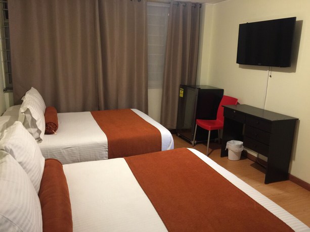 Imagen de la habitación del Hotel PSH Pasajero Suites Corferias. Foto 3