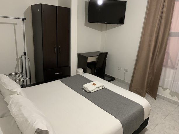 Imagen de la habitación del Hotel PSH Pasajero Suites Corferias. Foto 5