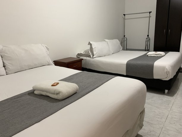 Imagen de la habitación del Hotel PSH Pasajero Suites Corferias. Foto 6