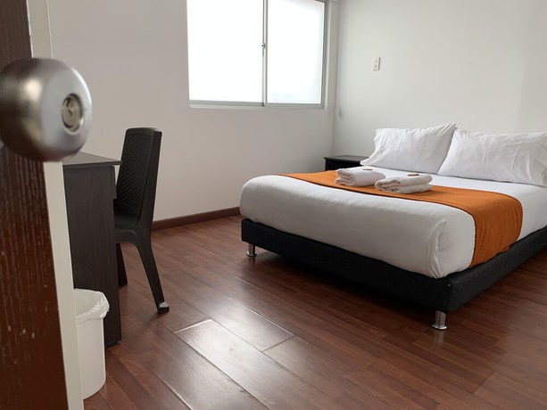 Imagen de la habitación del Hotel PSH Pasajero Suites Corferias. Foto 8