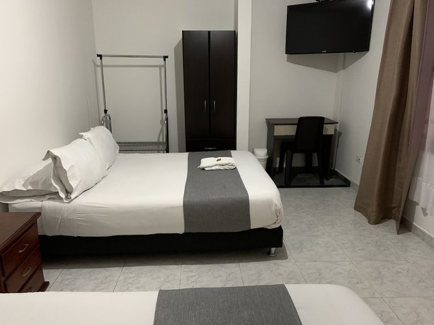 Imagen de la habitación del Hotel PSH Pasajero Suites Corferias. Foto 12