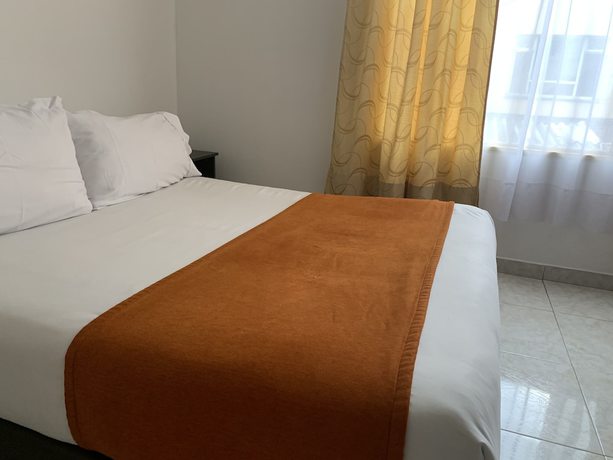 Imagen de la habitación del Hotel PSH Pasajero Suites Corferias. Foto 14