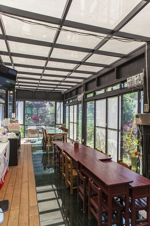 Imagen de los interiores del Hotel PULI GuanPu Fallsview Stay House. Foto 14