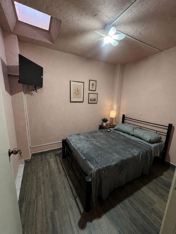Imagen de la habitación del Hotel PUNTO AMERICANA HOSTAL. Foto 9