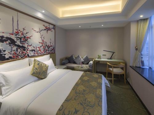 Imagen de la habitación del Hotel Paco Business Shunde Beijiao. Foto 7