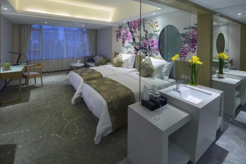 Imagen de la habitación del Hotel Paco Business Shunde Beijiao. Foto 10