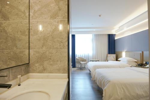 Imagen de la habitación del Hotel Paco Guangzhou North Railway Station. Foto 17