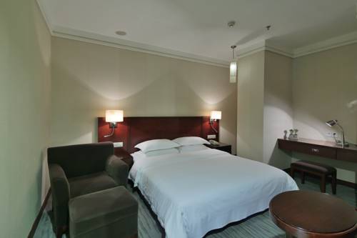 Imagen de la habitación del Hotel Paco Guangzhou Zhujiang New Town Branch. Foto 14