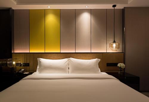 Imagen de la habitación del Hotel Paco Hotel Datang Metro Guangzhou. Foto 6