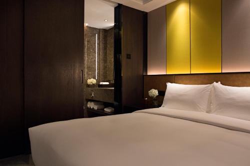 Imagen de la habitación del Hotel Paco Hotel Datang Metro Guangzhou. Foto 7