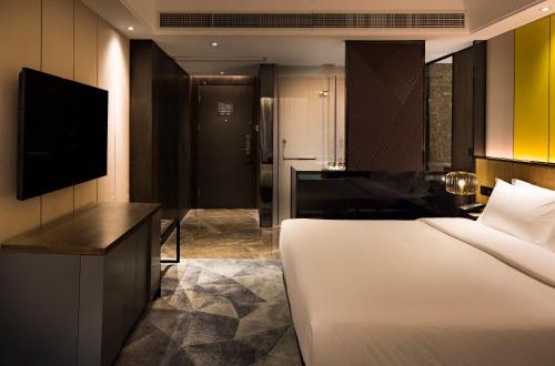 Imagen de la habitación del Hotel Paco Hotel Datang Metro Guangzhou. Foto 8