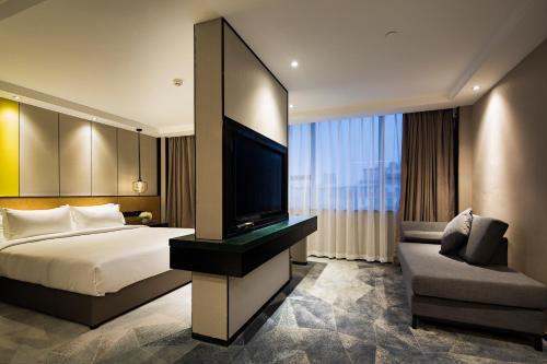 Imagen de la habitación del Hotel Paco Hotel Datang Metro Guangzhou. Foto 9