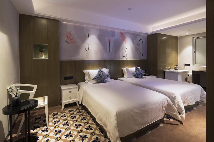 Imagen de la habitación del Hotel Paco Hotel Gangding Metro Guangzhou. Foto 8