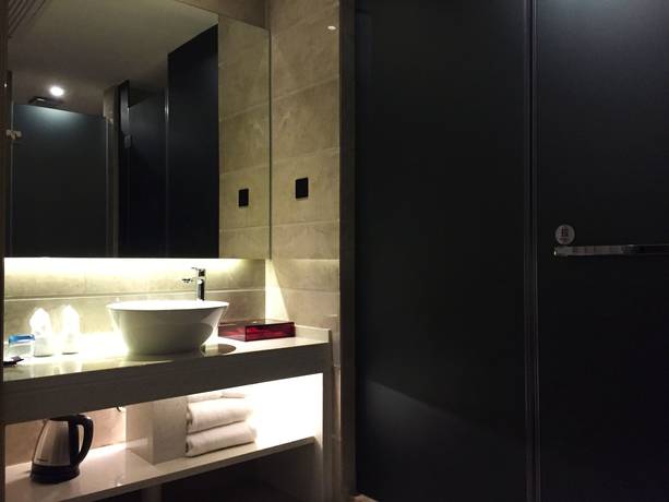 Imagen de la habitación del Hotel Paco Tiyuxilu Metro Guangzhou. Foto 12