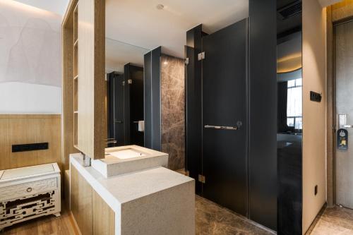 Imagen de la habitación del Hotel Paco Ya Zhanjiang Guomao People\'s Square. Foto 15