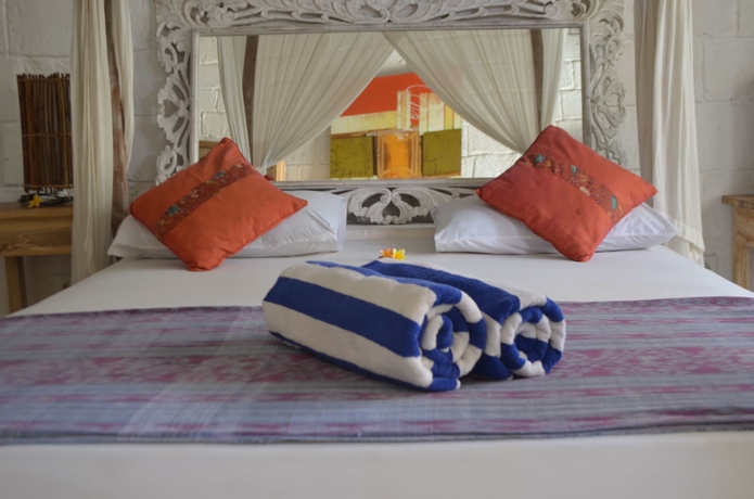 Imagen de la habitación del Hotel Padang Padang Breeze. Foto 10