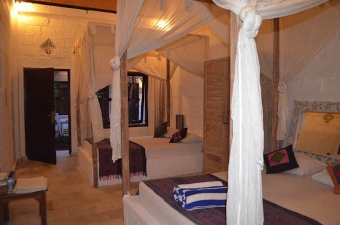 Imagen de la habitación del Hotel Padang Padang Breeze. Foto 11