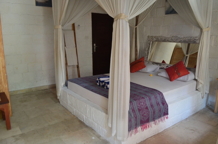 Imagen de la habitación del Hotel Padang Padang Breeze. Foto 12