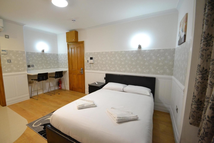 Imagen de la habitación del Hotel Paddington Apartments. Foto 2