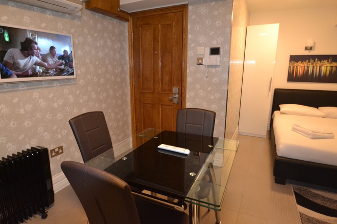 Imagen de la habitación del Hotel Paddington Apartments. Foto 9