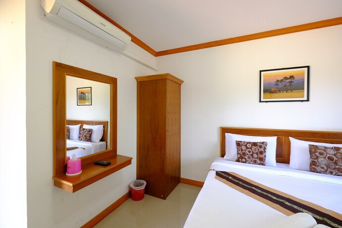 Imagen de la habitación del Hotel Paktraporn Resort. Foto 31