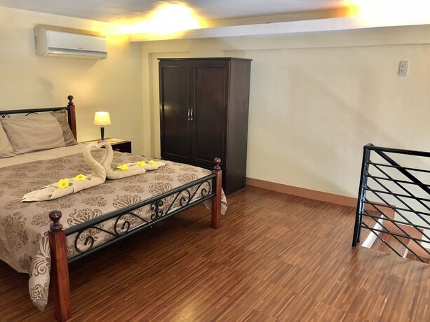 Imagen de la habitación del Hotel Pal-Watson Apartments. Foto 37