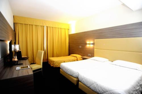 Imagen de la habitación del Hotel Palace Inn Rome Fiano. Foto 20