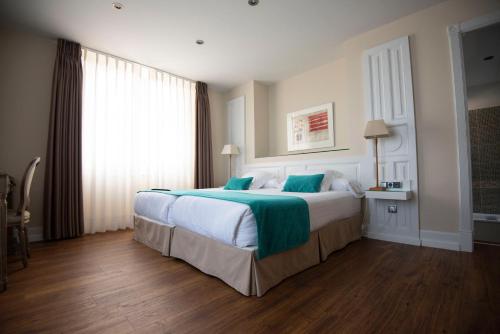 Imagen de la habitación del Hotel Palacete Villa Rosario. Foto 6