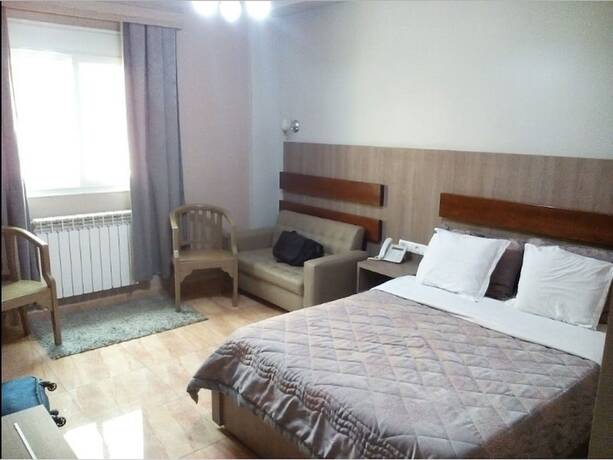 Imagen de la habitación del Hotel Palais Familial. Foto 18