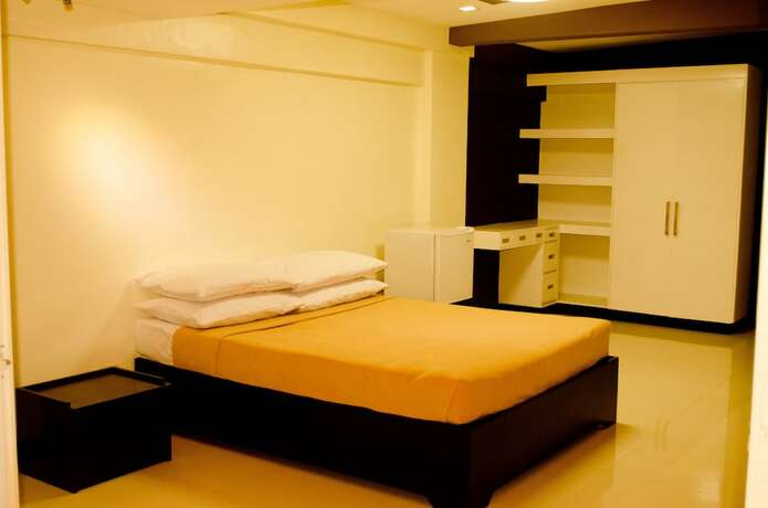 Imagen de la habitación del Hotel Palawan Palm Suites. Foto 14