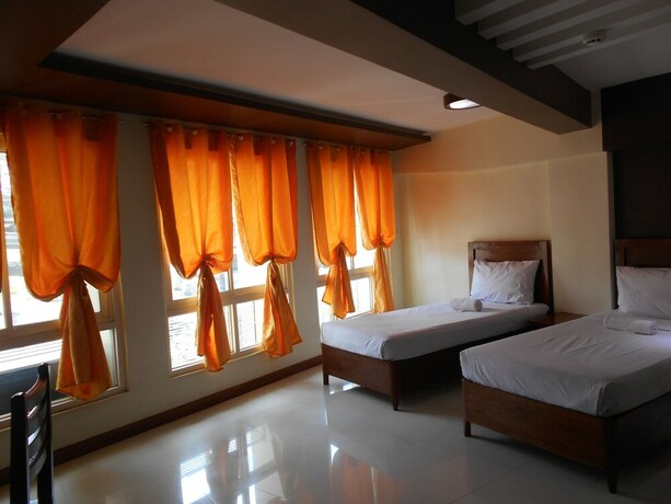 Imagen de la habitación del Hotel Palawan Palm Suites. Foto 20
