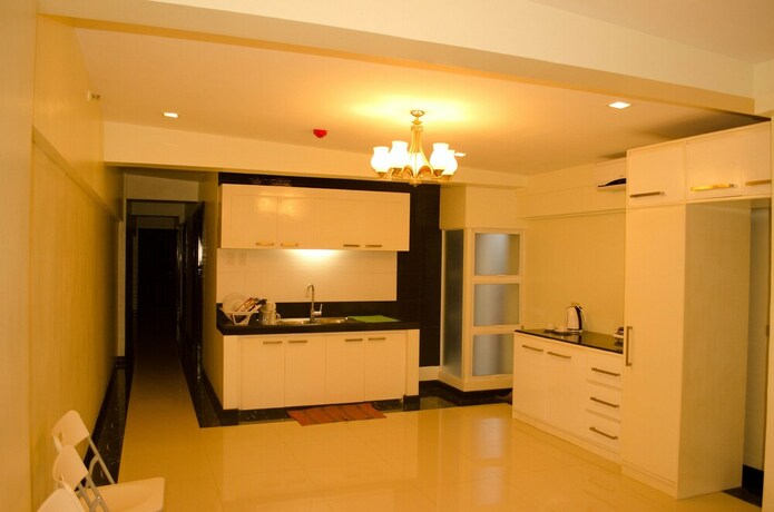 Imagen de la habitación del Hotel Palawan Palm Suites. Foto 23