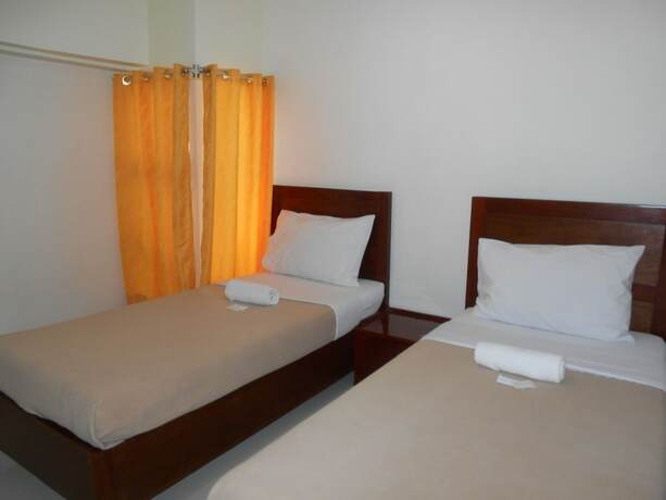 Imagen de la habitación del Hotel Palawan Palm Suites. Foto 28