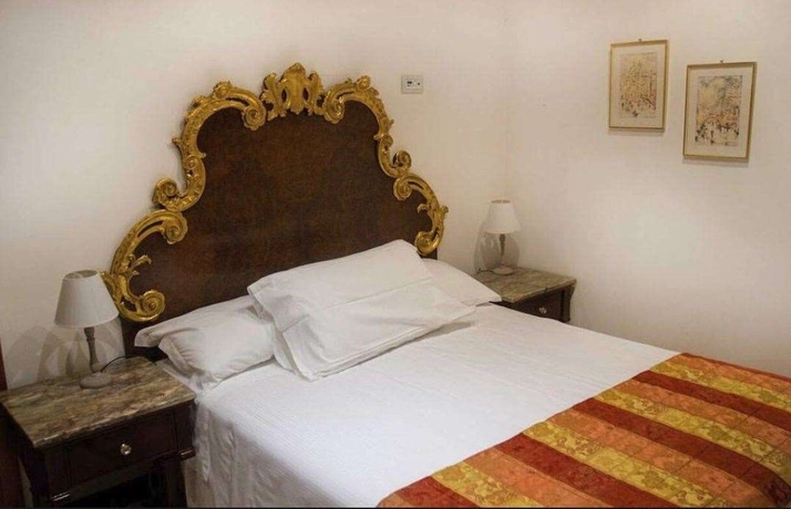 Imagen de la habitación del Hotel Palazzina Fortuny. Foto 18