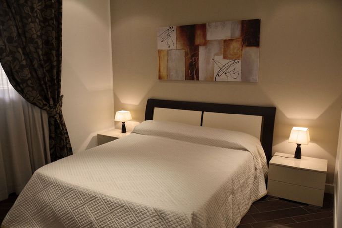 Imagen de la habitación del Hotel Palazzo Ducale Suites. Foto 9