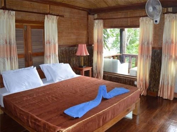 Imagen de la habitación del Hotel Palm Beach Bungalow Resort. Foto 2