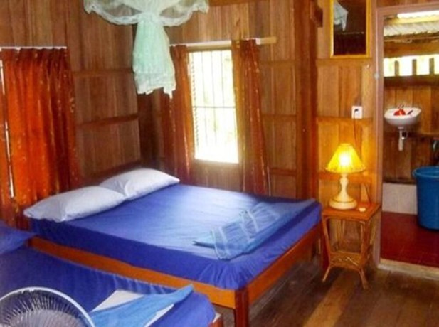 Imagen de la habitación del Hotel Palm Beach Bungalow Resort. Foto 4