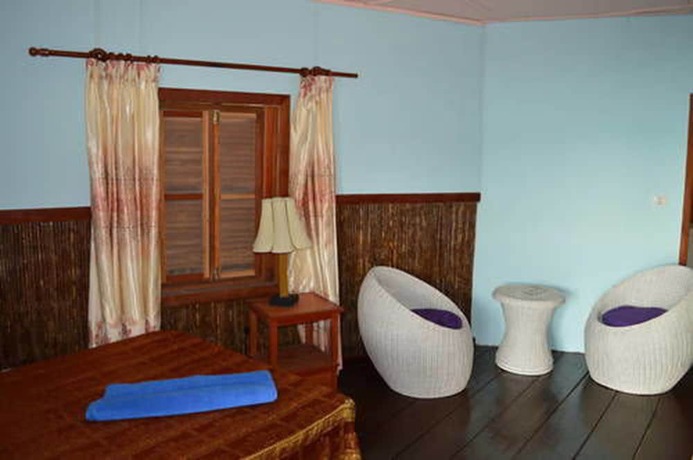 Imagen de la habitación del Hotel Palm Beach Bungalow Resort. Foto 12