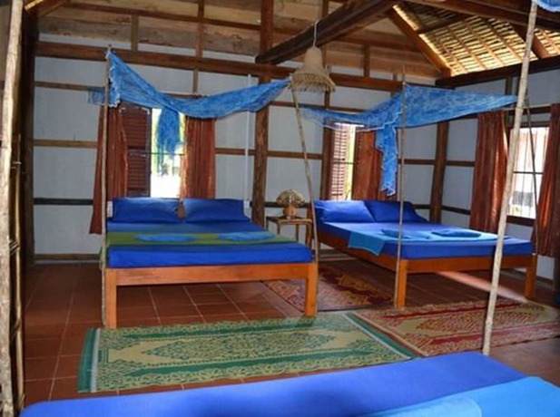 Imagen de la habitación del Hotel Palm Beach Bungalow Resort. Foto 16