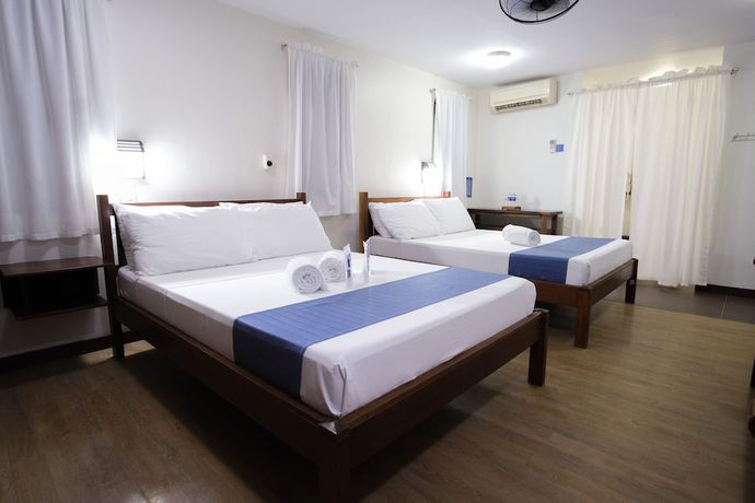 Imagen de la habitación del Hotel Palm Beach Resort, Hugom. Foto 7