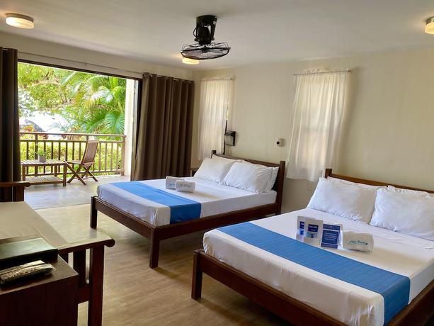 Imagen de la habitación del Hotel Palm Beach Resort, Hugom. Foto 13