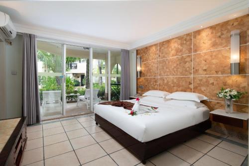 Imagen de la habitación del Hotel Palm Beach Resortandspa Sanya. Foto 4